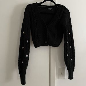 Black cropped cardigan with floral detail